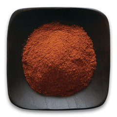 FNP054 | pile of red-brown ground spice in a square black dish
