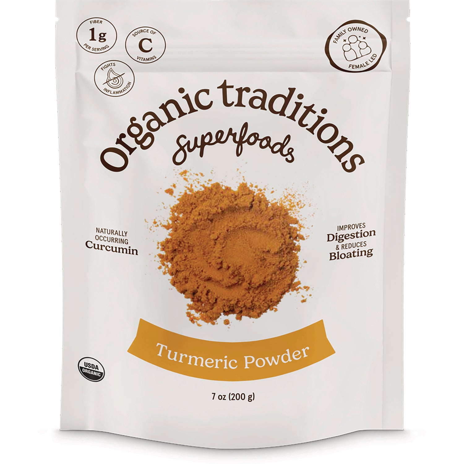 OTR069 | Organic Traditions Turmeric Powder 7 oz pouch front with a pile of turmeric powder