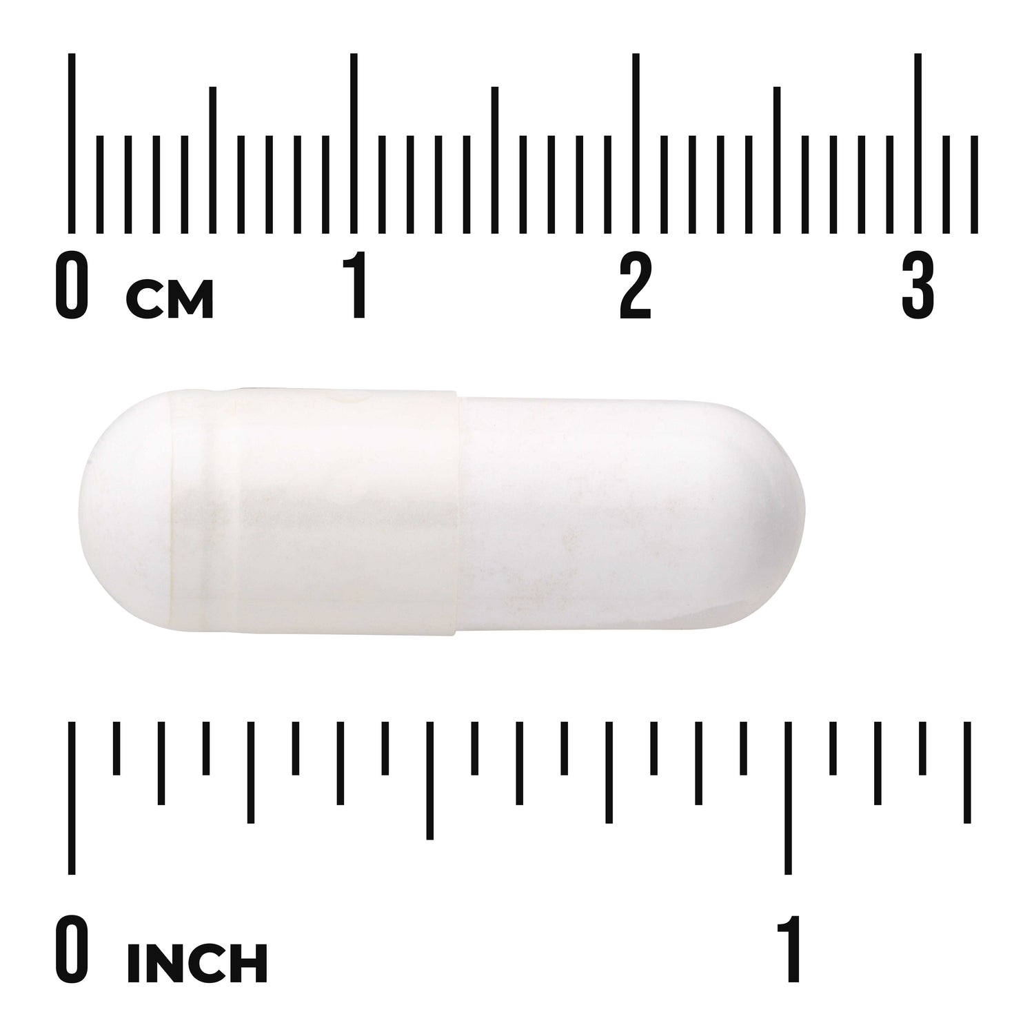 SW990 | White capsule next to centimeter and inch rulers
