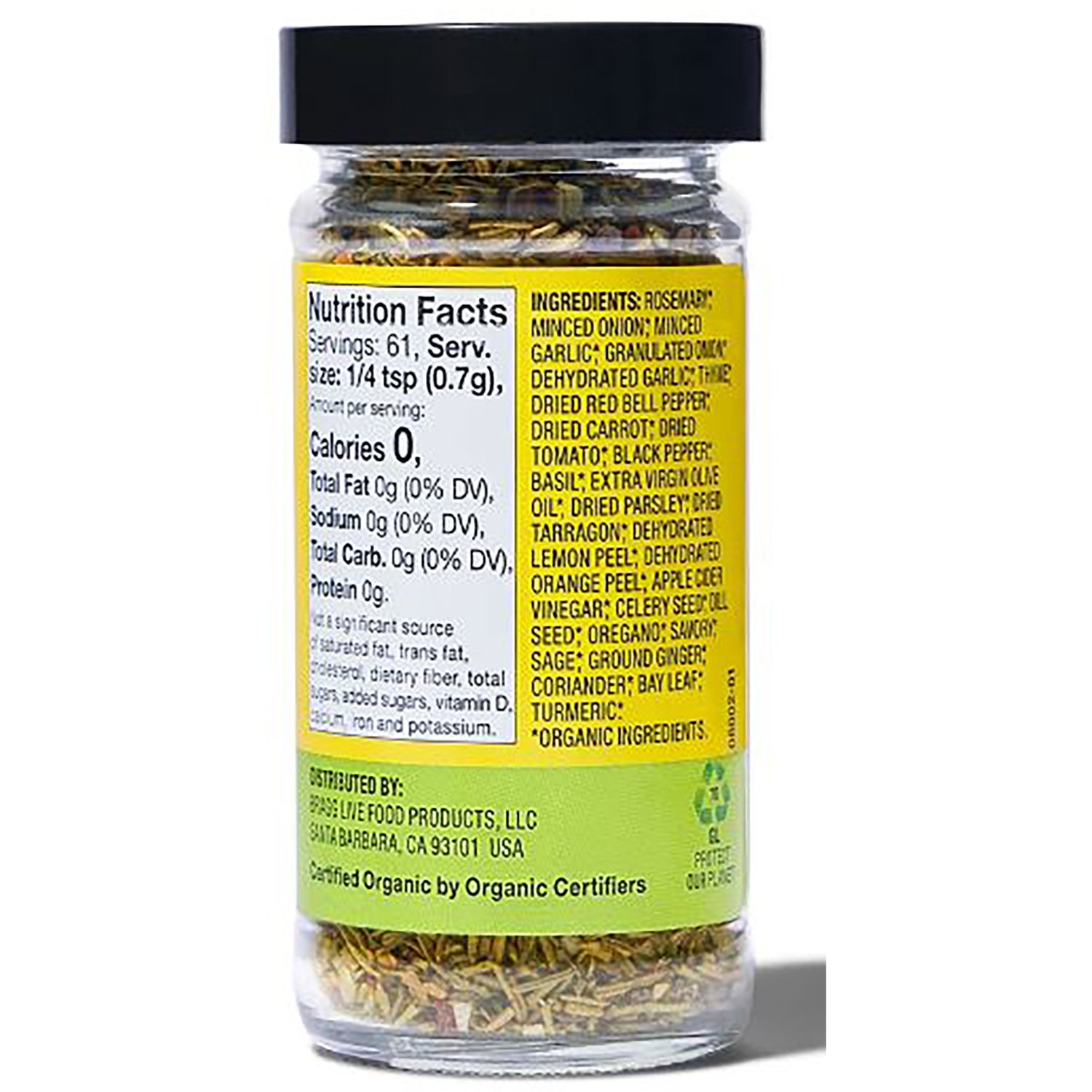 BR011 | Back of glass spice jar showing nutrition facts and ingredients list on yellow label, black lid and dried herbs