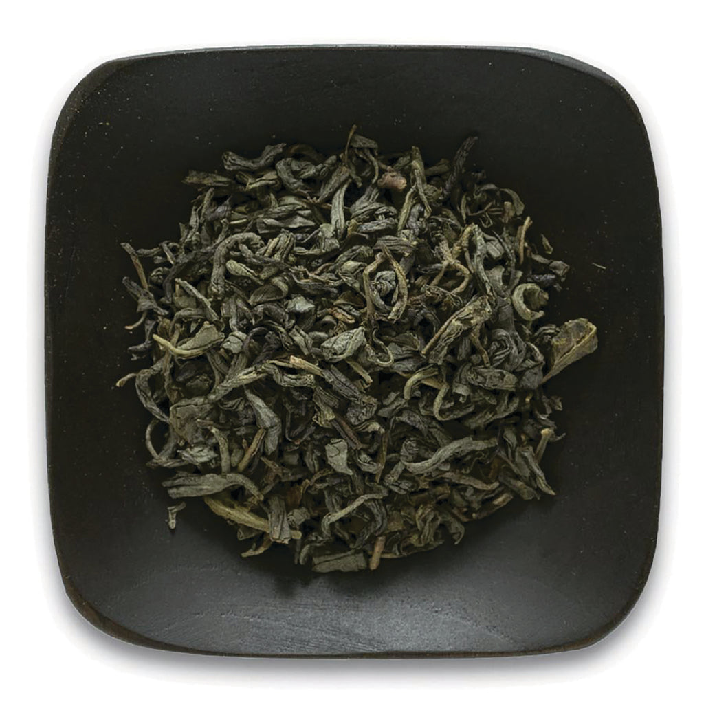 FNP028 | loose dried green tea leaves on a dark square plate - Thumbnail