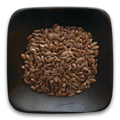 FNP016 | dark wooden square bowl filled with brown flax seeds