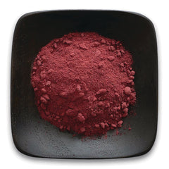 FNP388 | pile of deep red powder in a black square dish