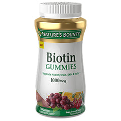 NBY058 | Nature's Bounty Biotin Gummies 1000mcg white bottle with gold cap and grape and cherry illustration