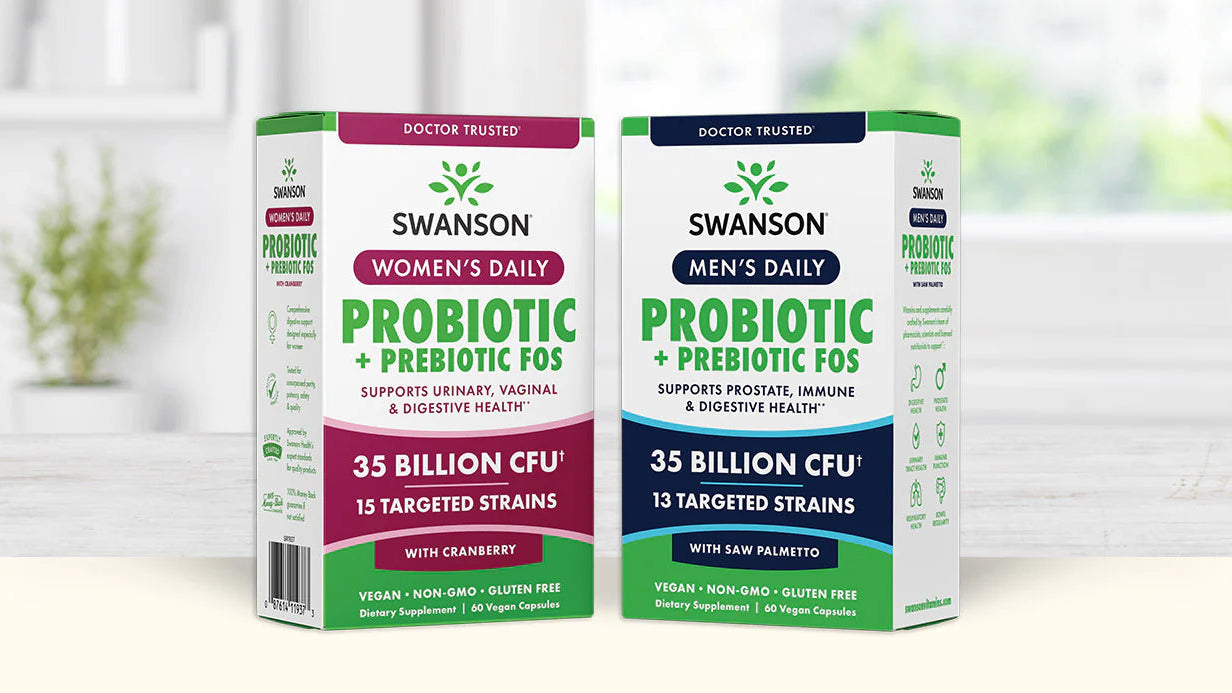 Two Swanson brand probiotic supplement boxes on a white surface with a blurred indoor background.