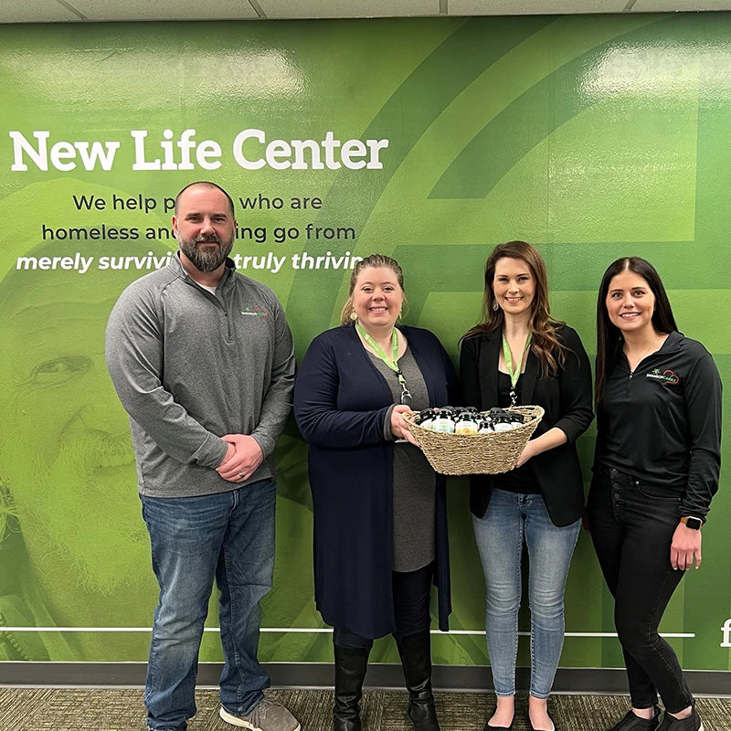 Product donation being presented to representatives of the New Life Center