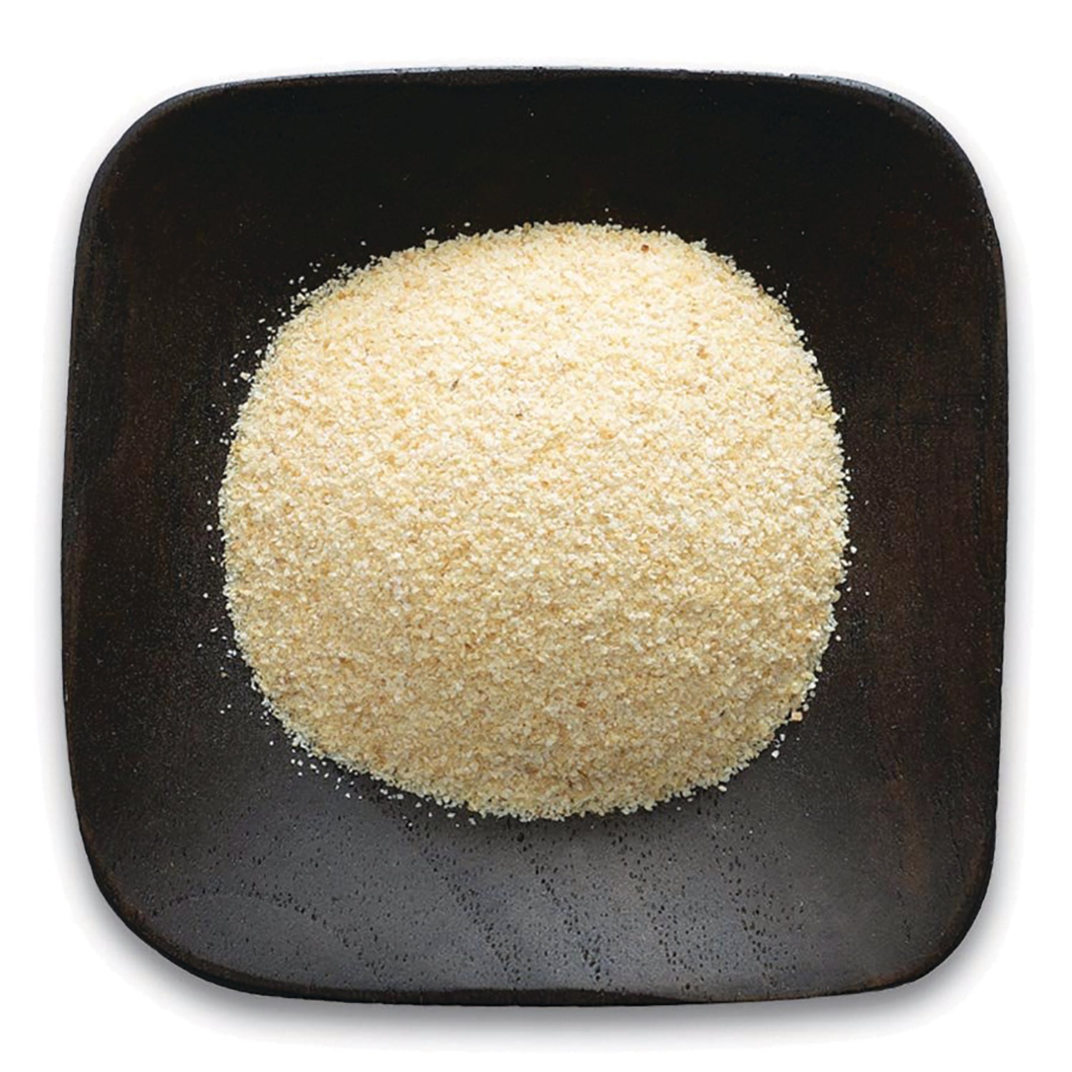 FNP036 | mound of fine pale yellow powder on a dark square wooden plate