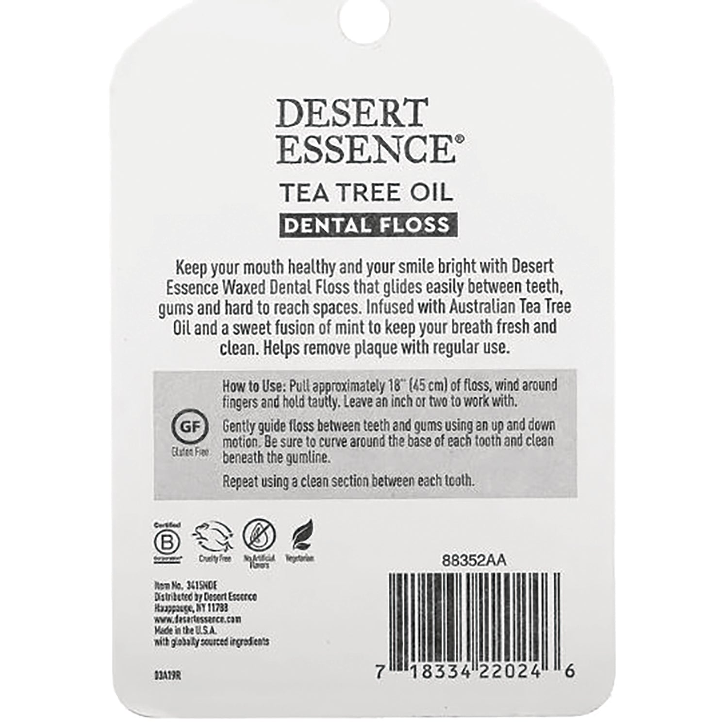 DESERT ESSENCE tea tree oil dental floss back packaging showing usage instructions, barcode, and certification icons