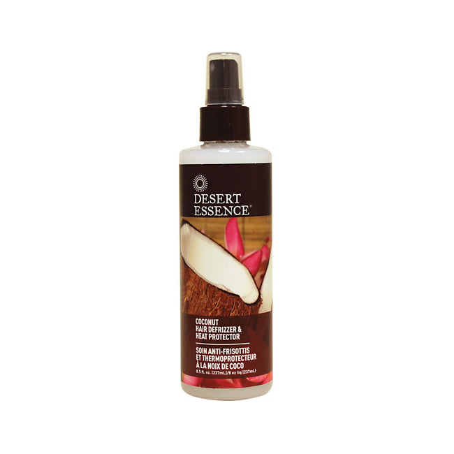 DESERT ESSENCE coconut hair defrizzer & heat protector spray bottle on white background