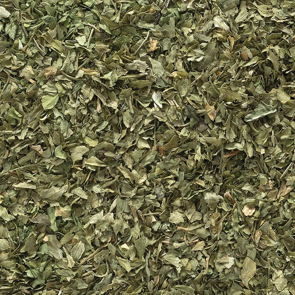 FNP073 | close-up of dried green herb flakes showing loose leaf form - Thumbnail