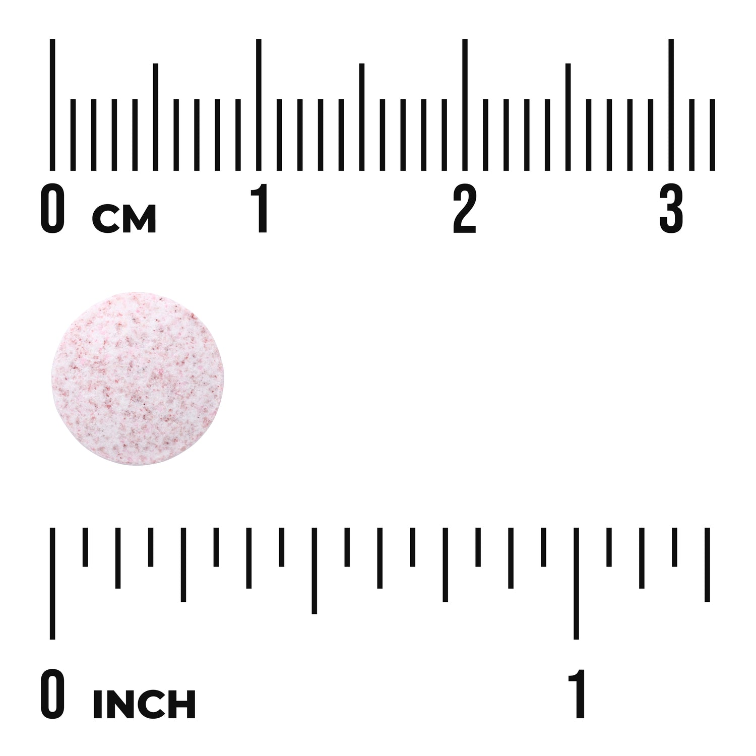 SWU869 | Pink speckled round tablet next to centimeter and inch rulers labeled "0 CM" and "0 INCH" showing size