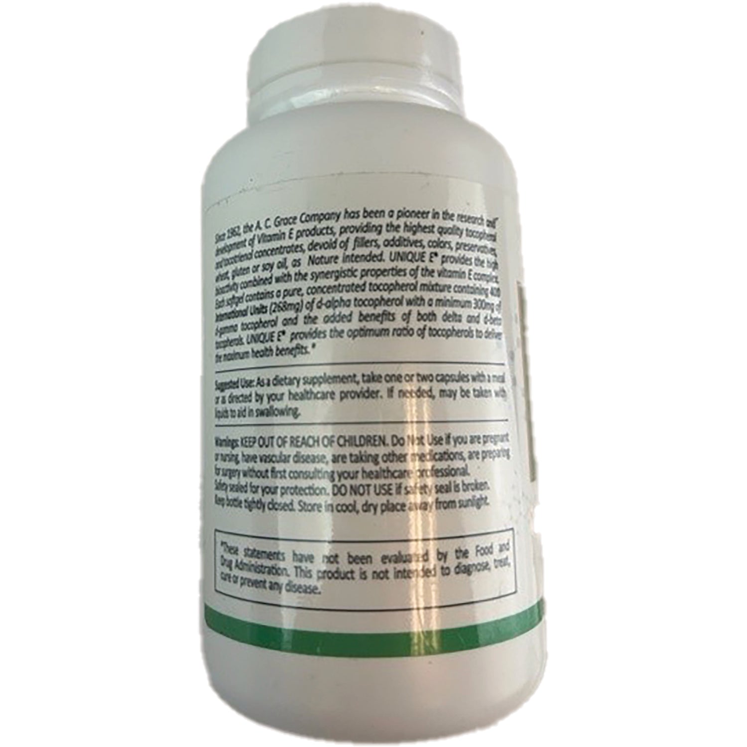 ACG002 | Back of white supplement bottle showing warning, usage and nutrition text including 'KEEP OUT OF REACH OF CHILDREN'