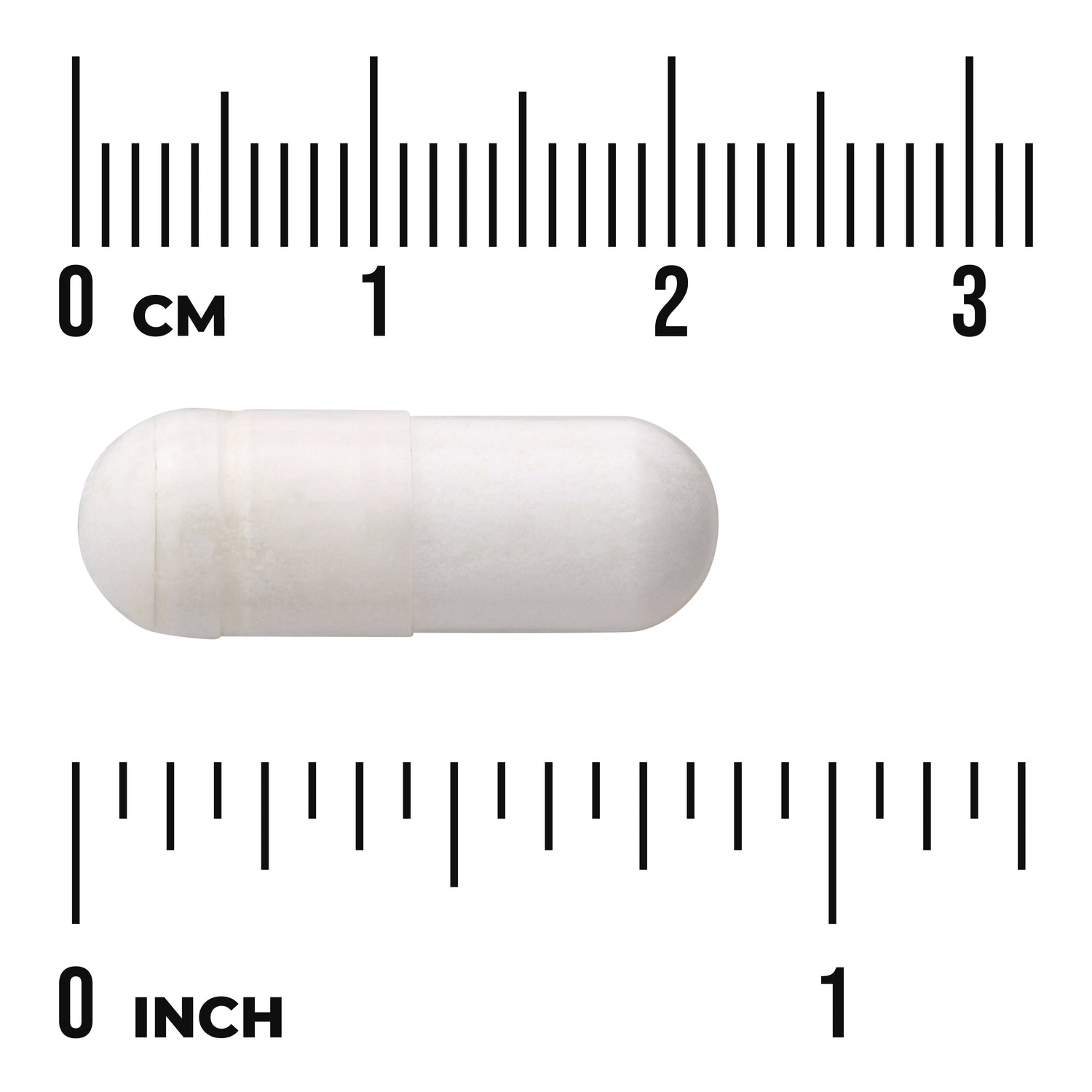 SWU977 | White capsule shown against centimeter and inch rulers for scale with visible text "CM" and "INCH"
