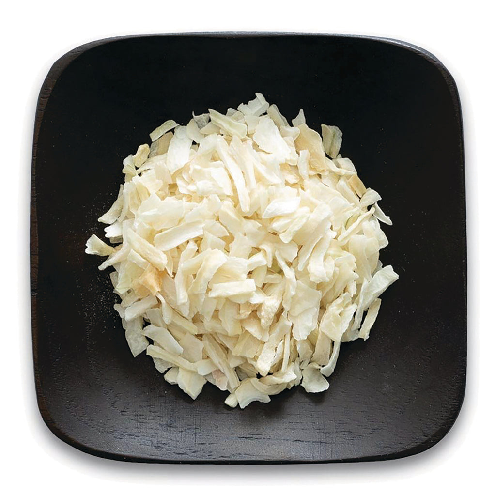 FNP064 | pile of shredded white coconut flakes on a dark square plate - Thumbnail