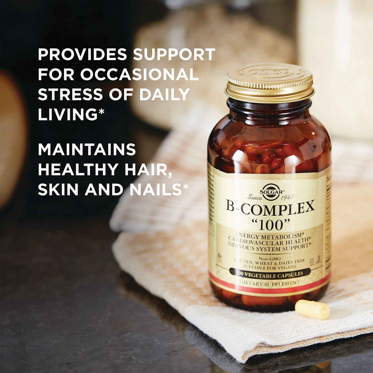 SLG210 | Solgar B-Complex 100 bottle and capsule with overlay text about stress support and healthy hair, skin, nails