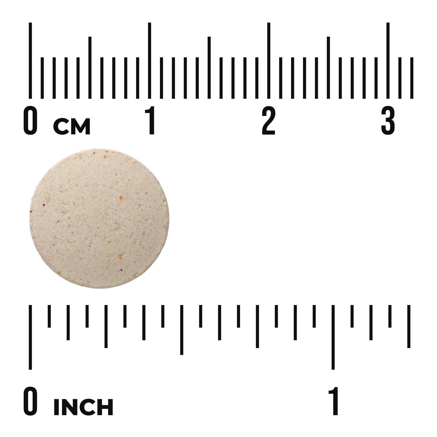 SW835 | Round beige tablet with speckles beside ruler showing 0 cm and 0 inch for size