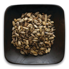 FNP023 | dark square wooden bowl filled with light and dark brown seeds
