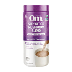 MMX051 | Om Superfood Mushroom Blend Hot Chocolate powder container with purple front label showing 30 servings and poured cup