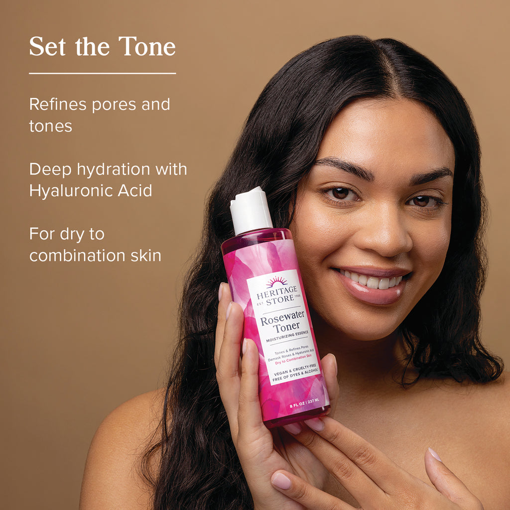 HTG118 | Woman holding Heritage Store Rosewater Toner bottle, smiling with product benefit text at left - Thumbnail