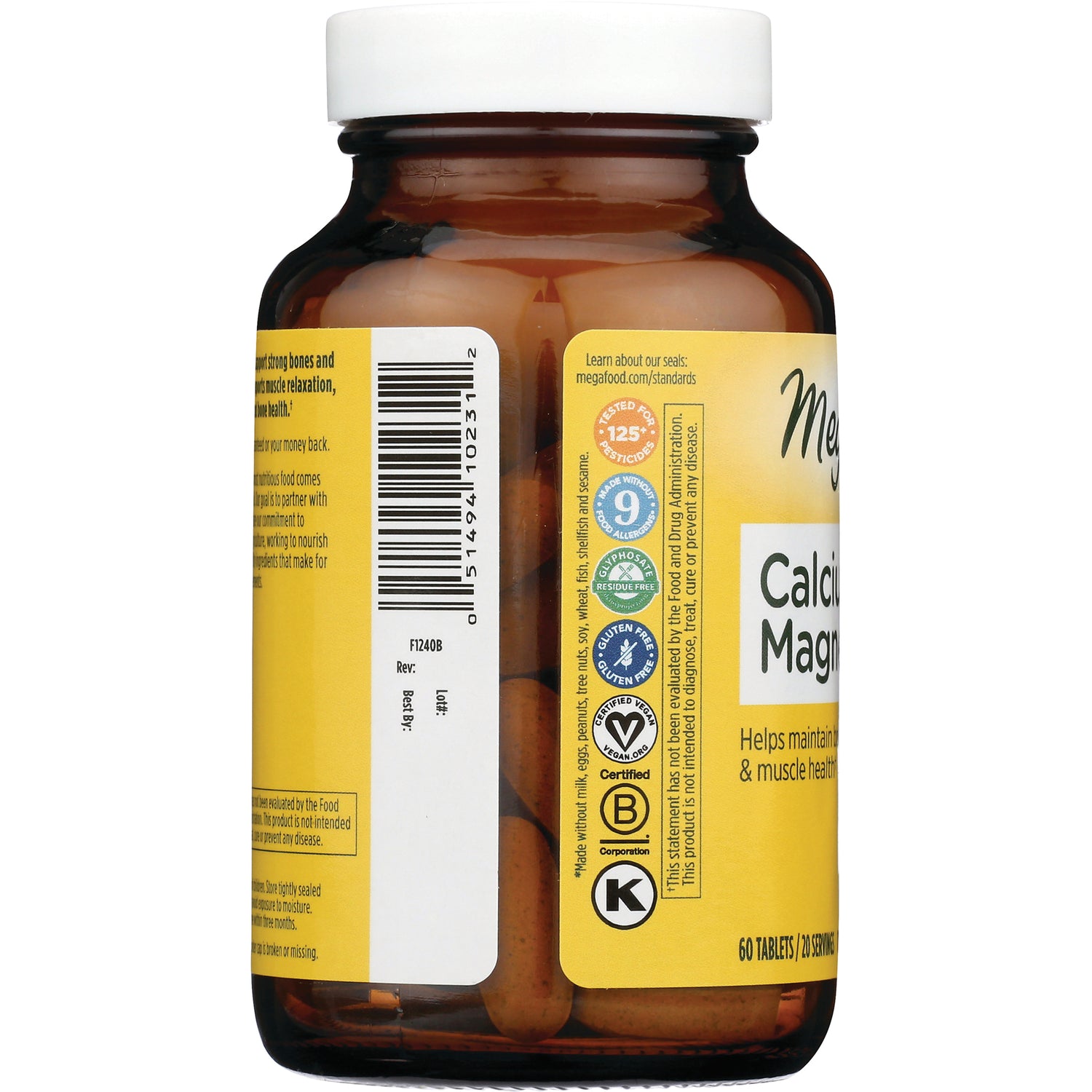MGF039 | Back of amber supplement bottle with barcode, certification icons, partial label reading Calcium Magnesium and visible tablets