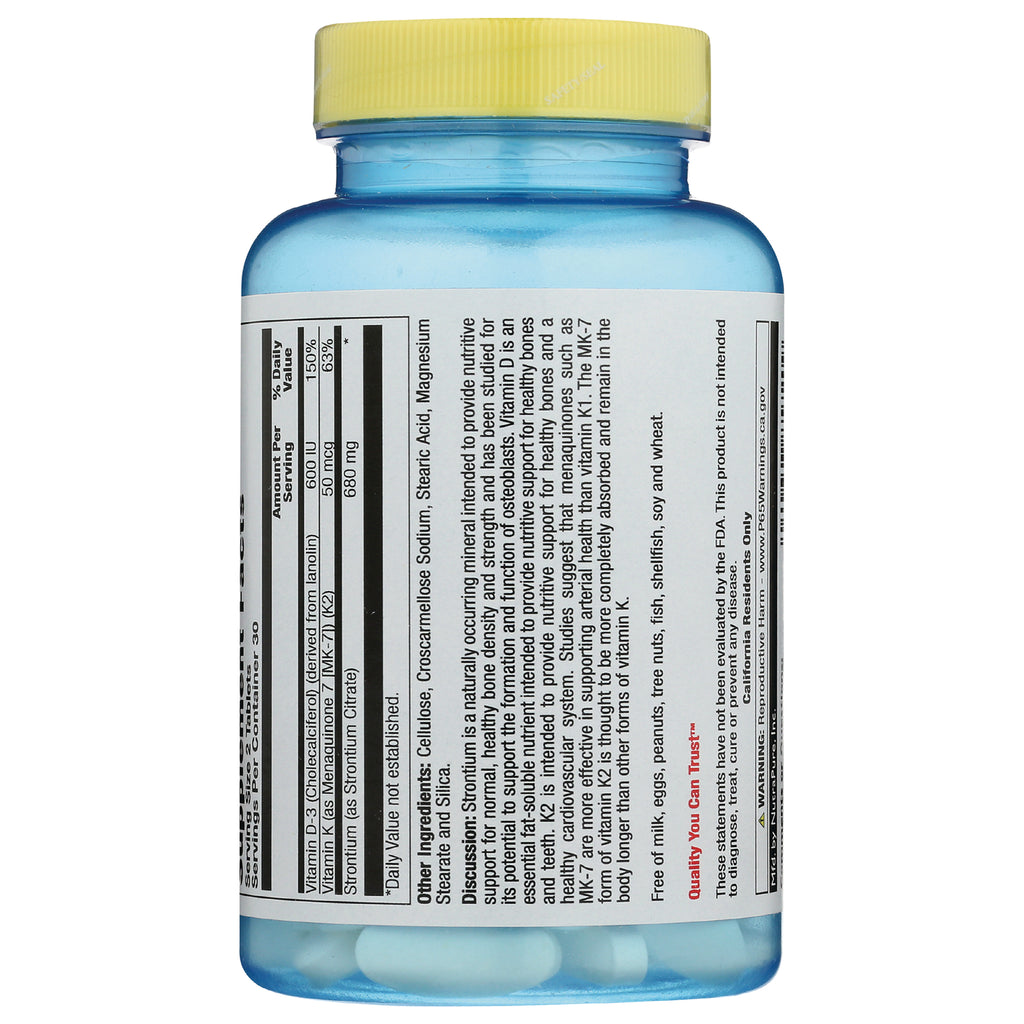 NSL032 | blue supplement bottle back label showing nutrition facts panel, yellow cap and white tablets visible - Thumbnail