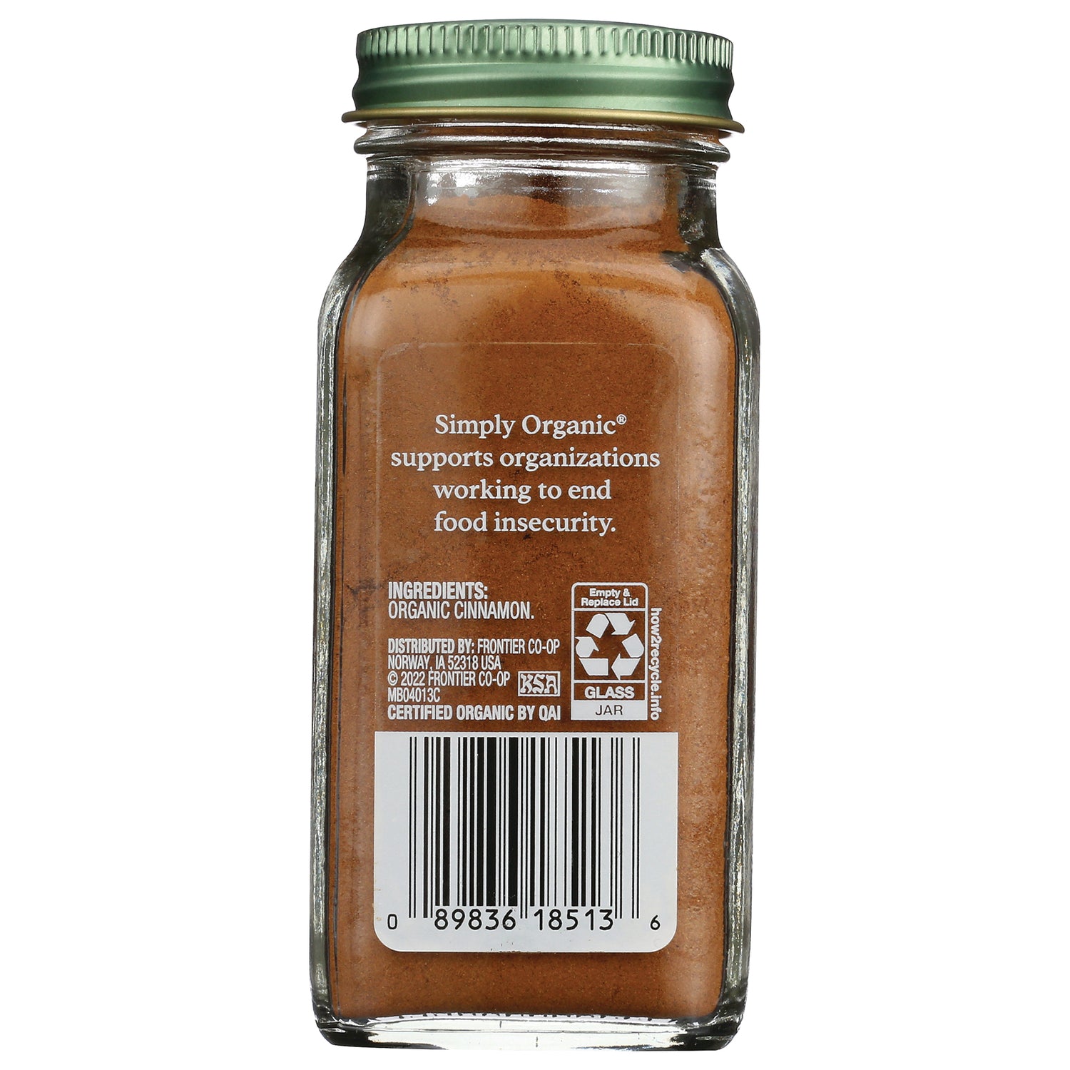 SMP009 | Back of glass jar labeled organic cinnamon showing ingredients, recycling symbol, and barcode