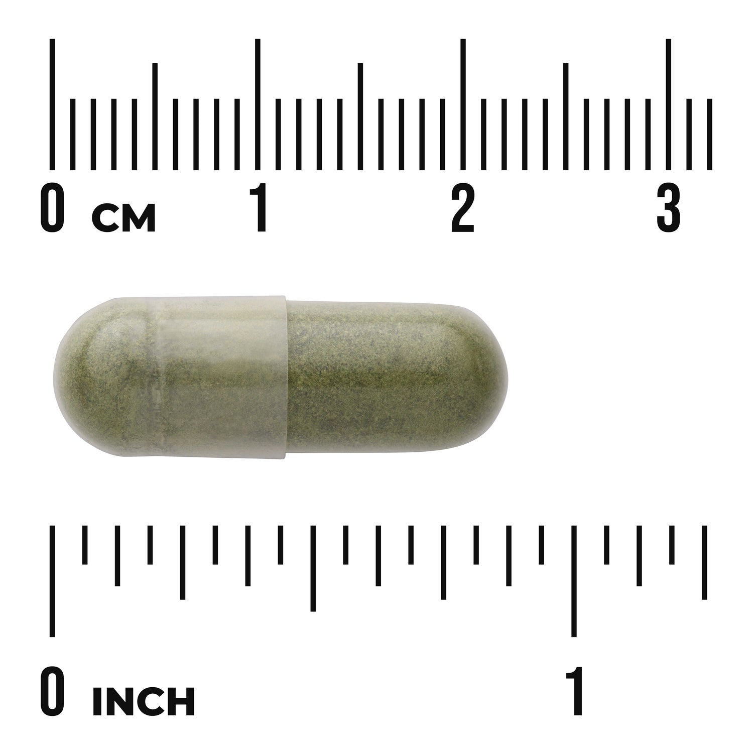 SWR092 | Green supplement capsule on rulers marked 03 cm and 01 inch showing size about 1 inch