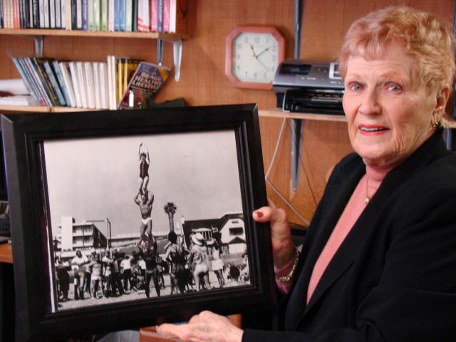Elaine LaLanne shows a photo of herself atop a human pyramid at Muscle Beach